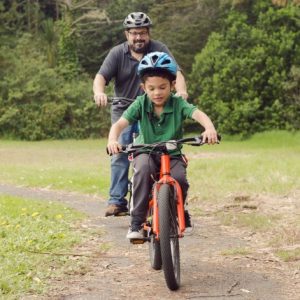 Man and boy on bikes