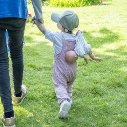 adult-and-child-walking-hand-in-hand